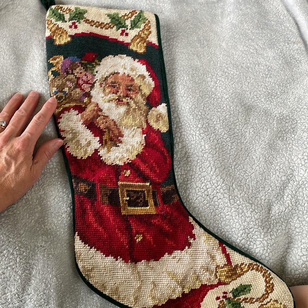 Beautiful classic needlepoint Santa stocking. Green velvet back fully lined.